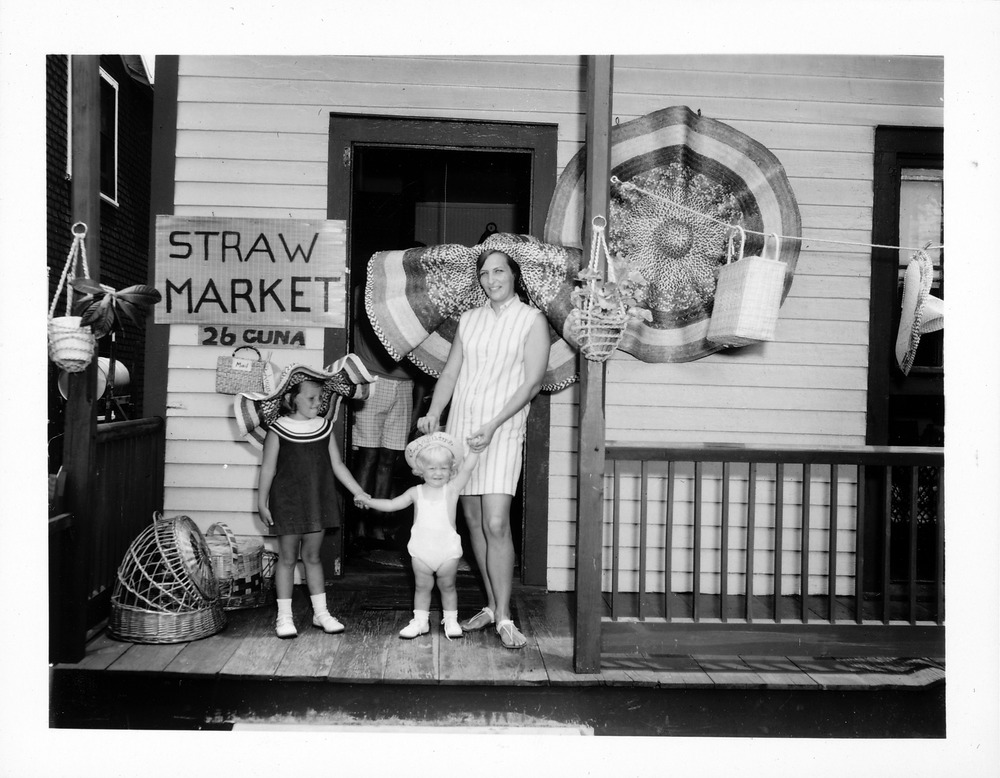 Straw Market at Cerveau House with mother and two children on porch, looking North, 1968