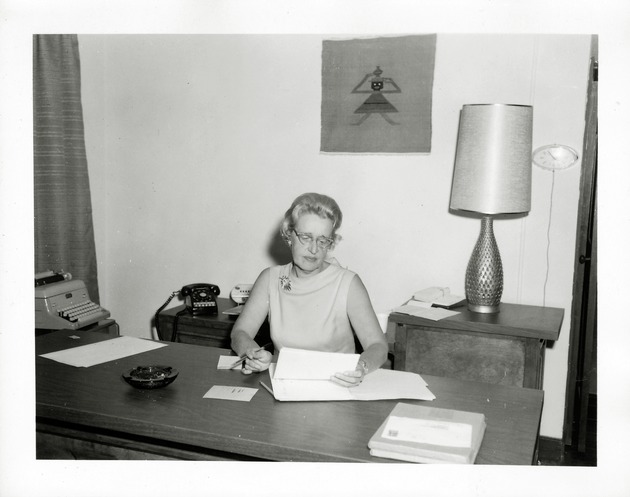 Marion Randolph working at her desk