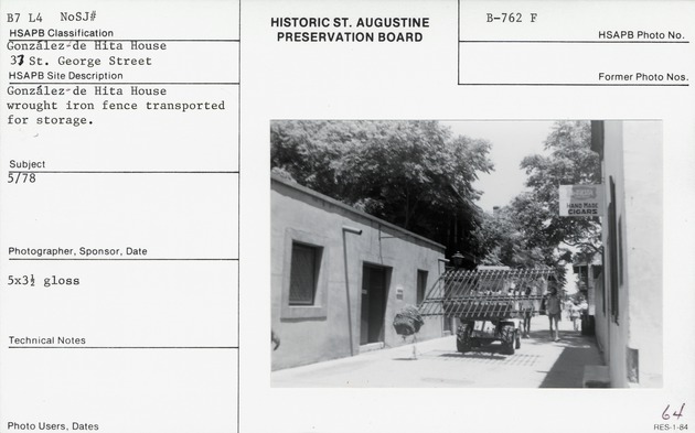 A section of the fence from the Gonzales-de Hita site being transported down St. George Street, from in front of the Oliveros House, looking North