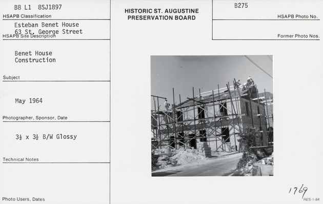 Working on the roof of the Benet House during restoration, from Cuna Street, looking Southwest