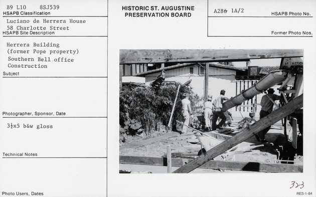 Pouring concrete during the construction of the Herrera House, looking East