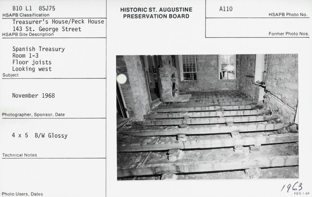 Exposed floor joists in Room 3 on the first floor of the Peña-Peck House during restoration, looking West