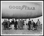 National Park Association officials standing by Goodyear blimp, Miami Municipal Airport, February 11, 1930.